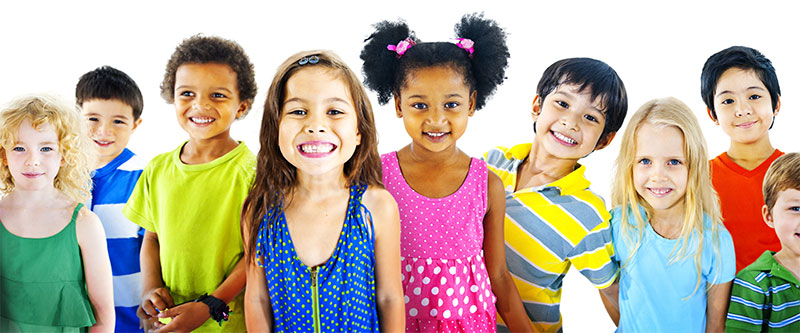 The image shows a diverse group of children with various skin tones and hair colors, posing together for a photograph with smiles on their faces.